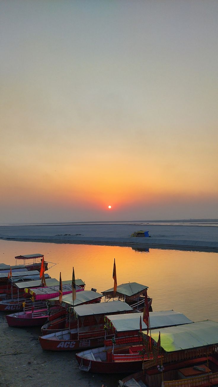Guptar Ghat — quiet stone steps down to the Saryu under old trees, few people